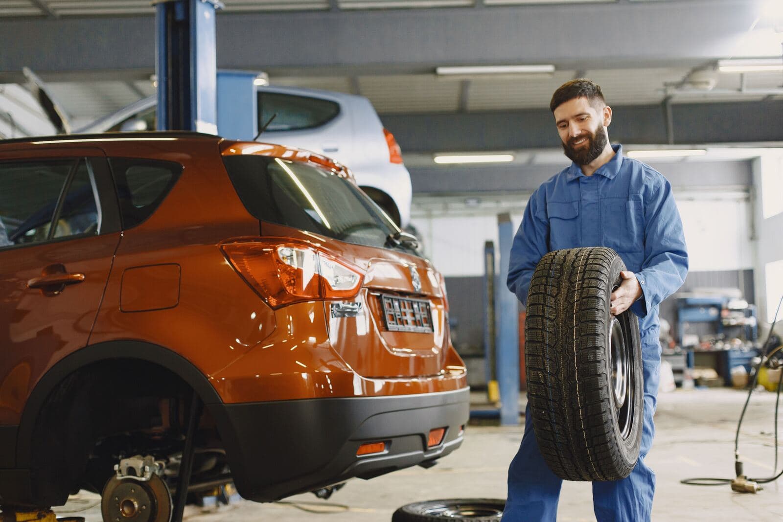 Technician mounting a tire